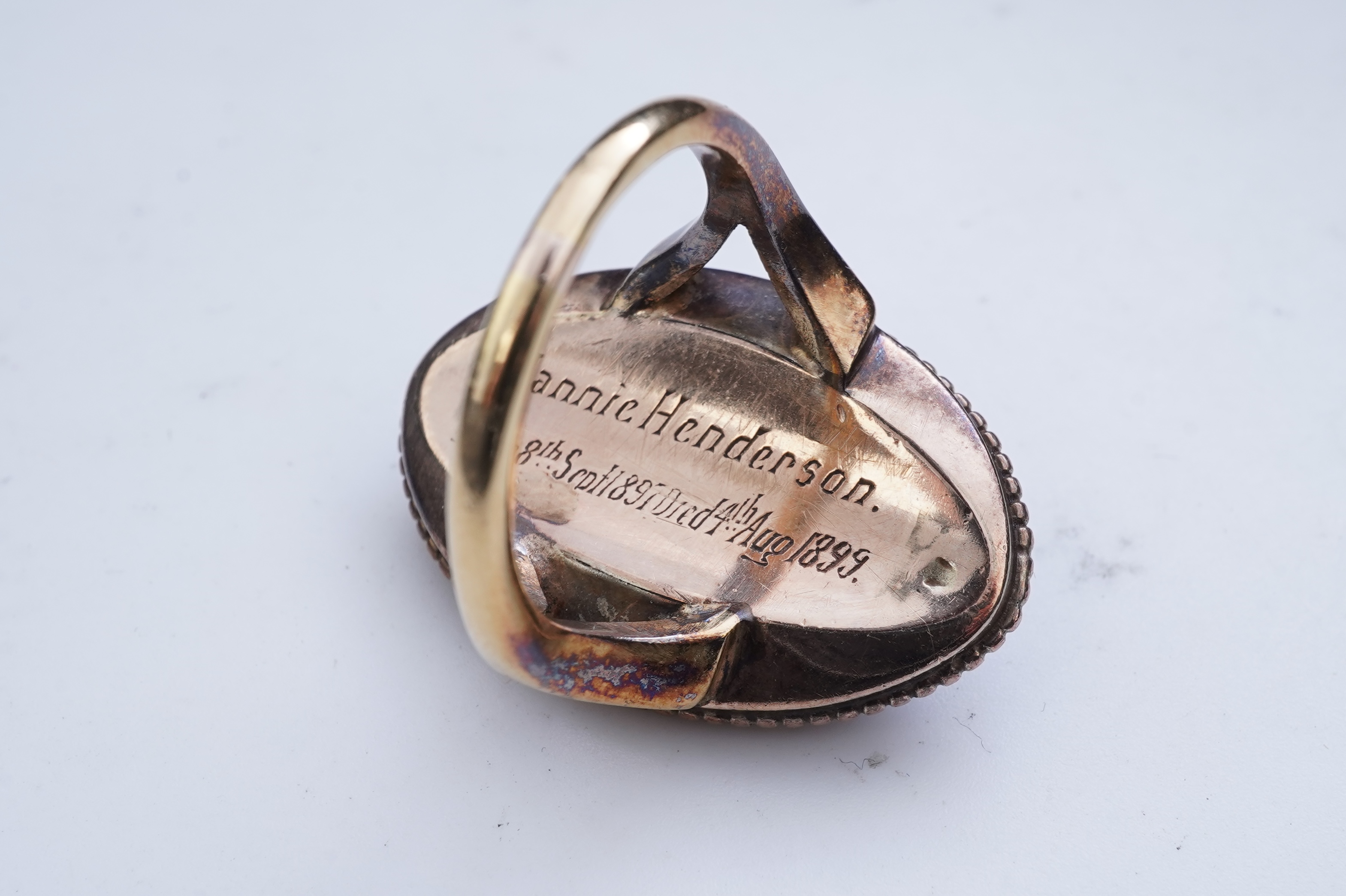 An enamel and diamond mourning ring, late 19th century